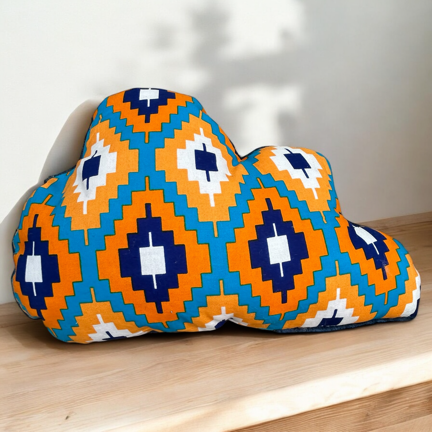 Coussin doux nuage wax orange et turquoise